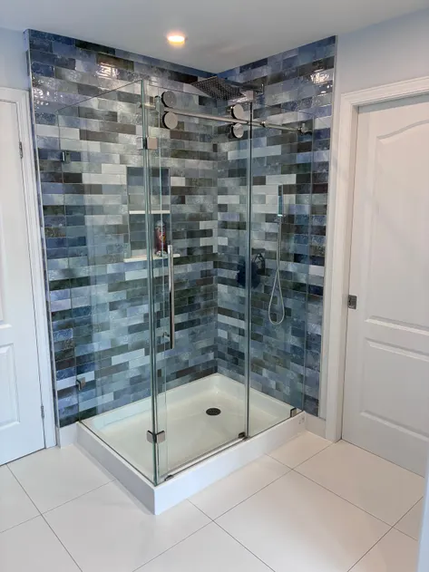 Glass shower with blue tile